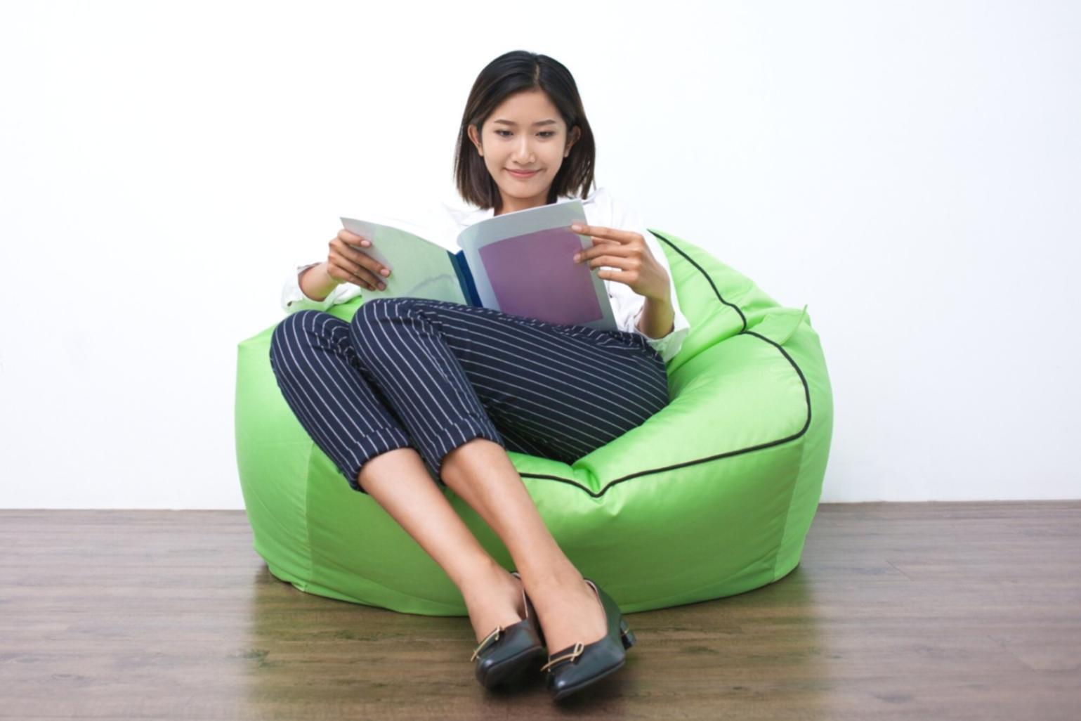 Professional working on budget analysis with multiple monitors displaying financial charts and spreadsheets